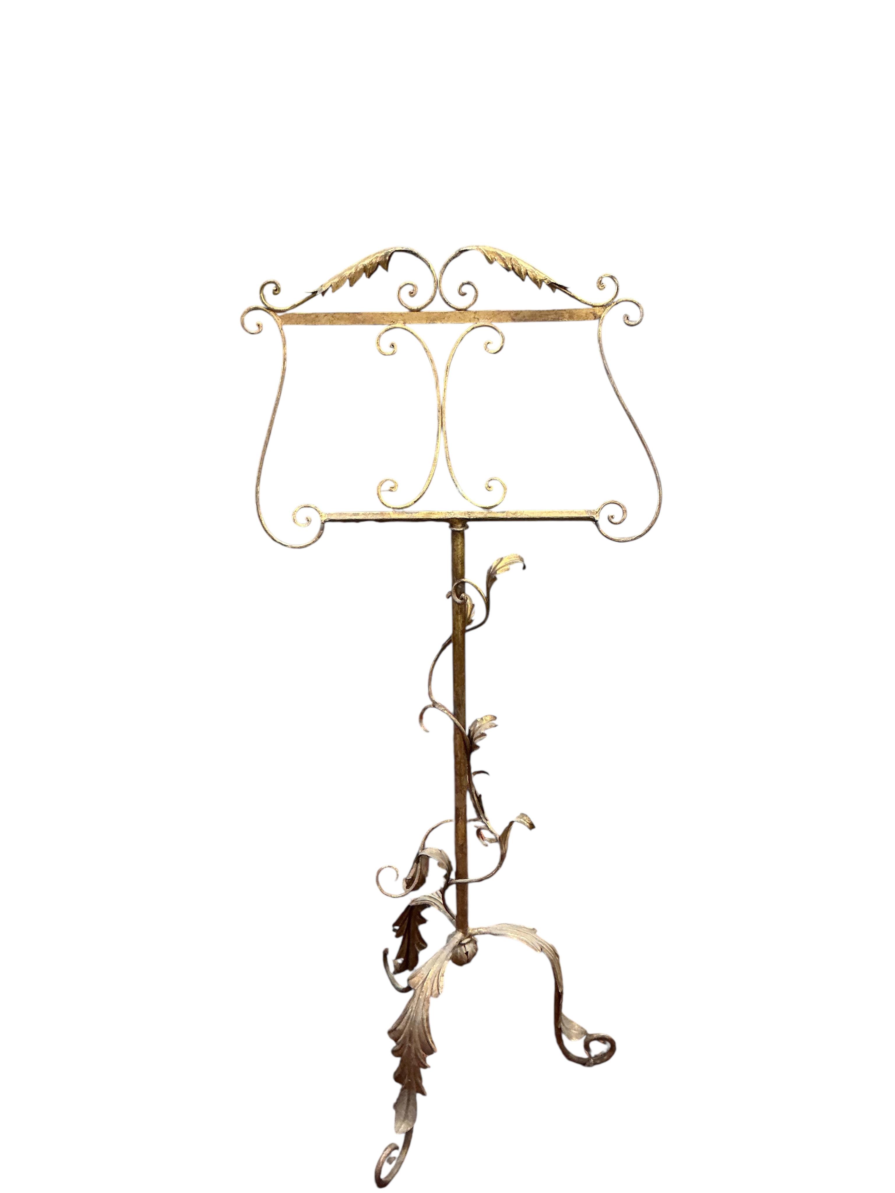 An early Victorian rosewood duet music stand together with a gilt painted wrought iron music stand
